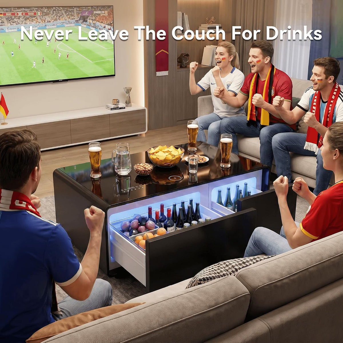 Friends watching sport around the Smart Coffee Table with chilled drinks in the open fridge drawer