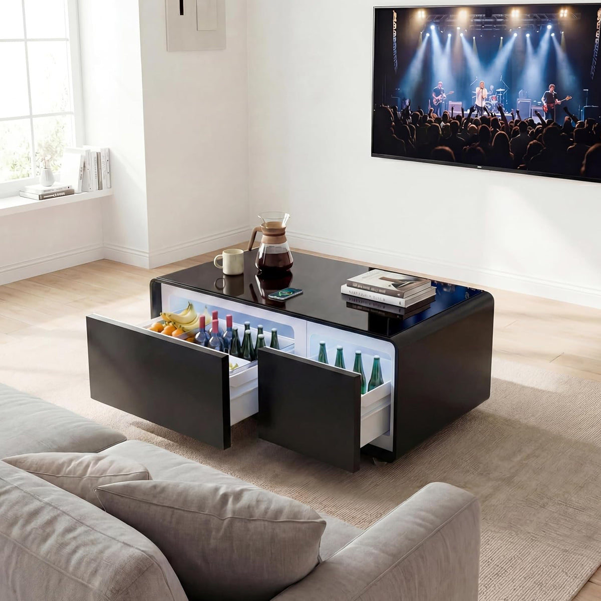 Smart Coffee Table in a lounge with both refrigerated drawers open and interior lighting on